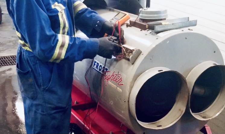 Technician Repairing Frost Fighter Heater